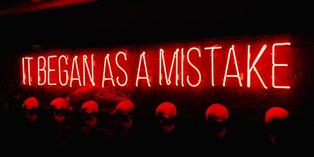 Neon sign about mistakes