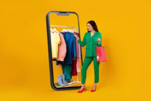Women choosing colored clothes on mobile e-commerce